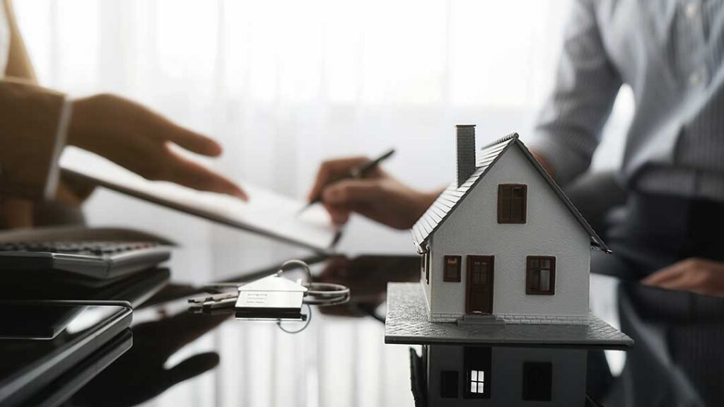 A person takes photos of storm damage to their house and roof using a smartphone while holding an insurance policy folder.